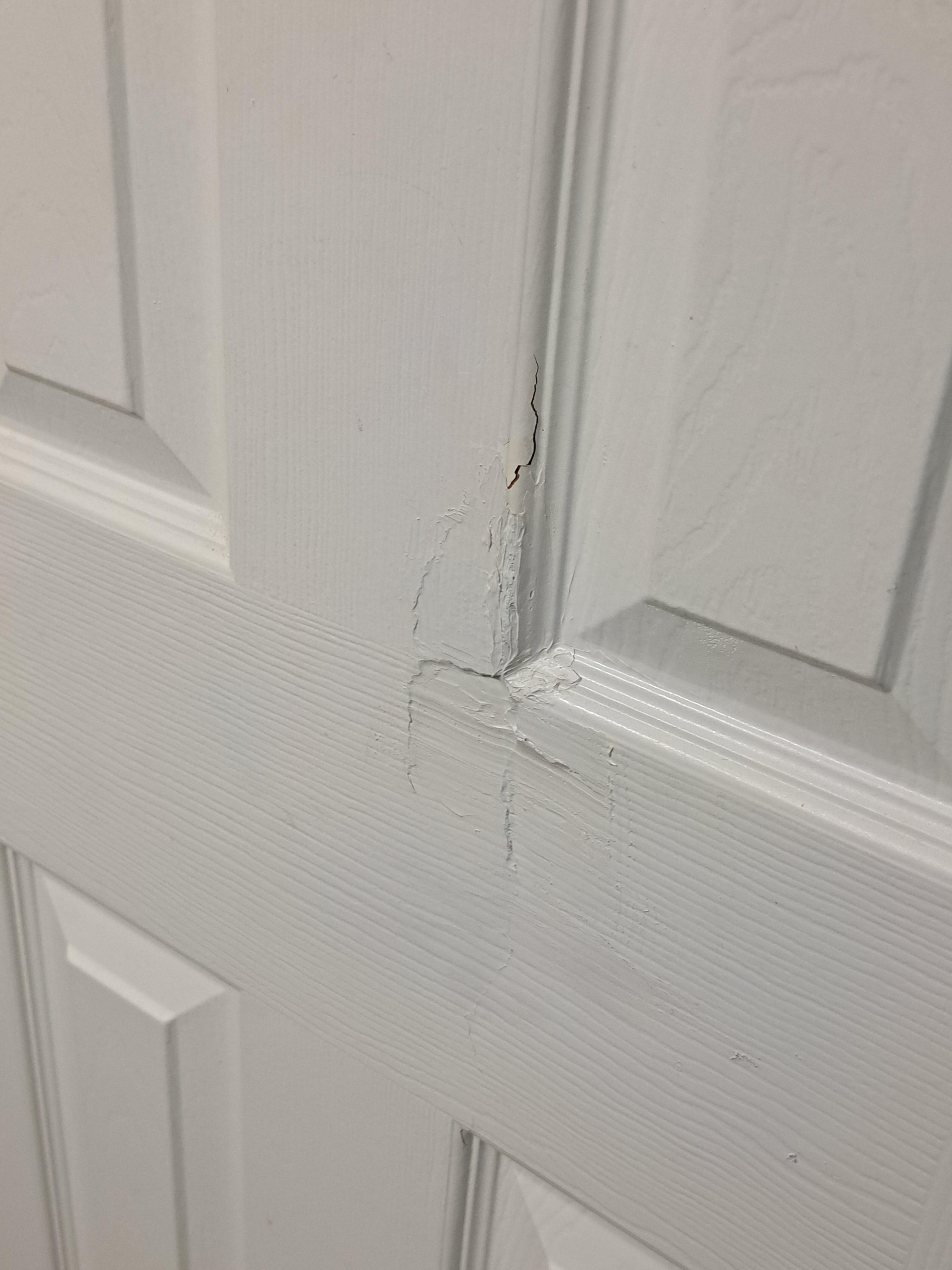 A hole in the bathroom door was badly patched