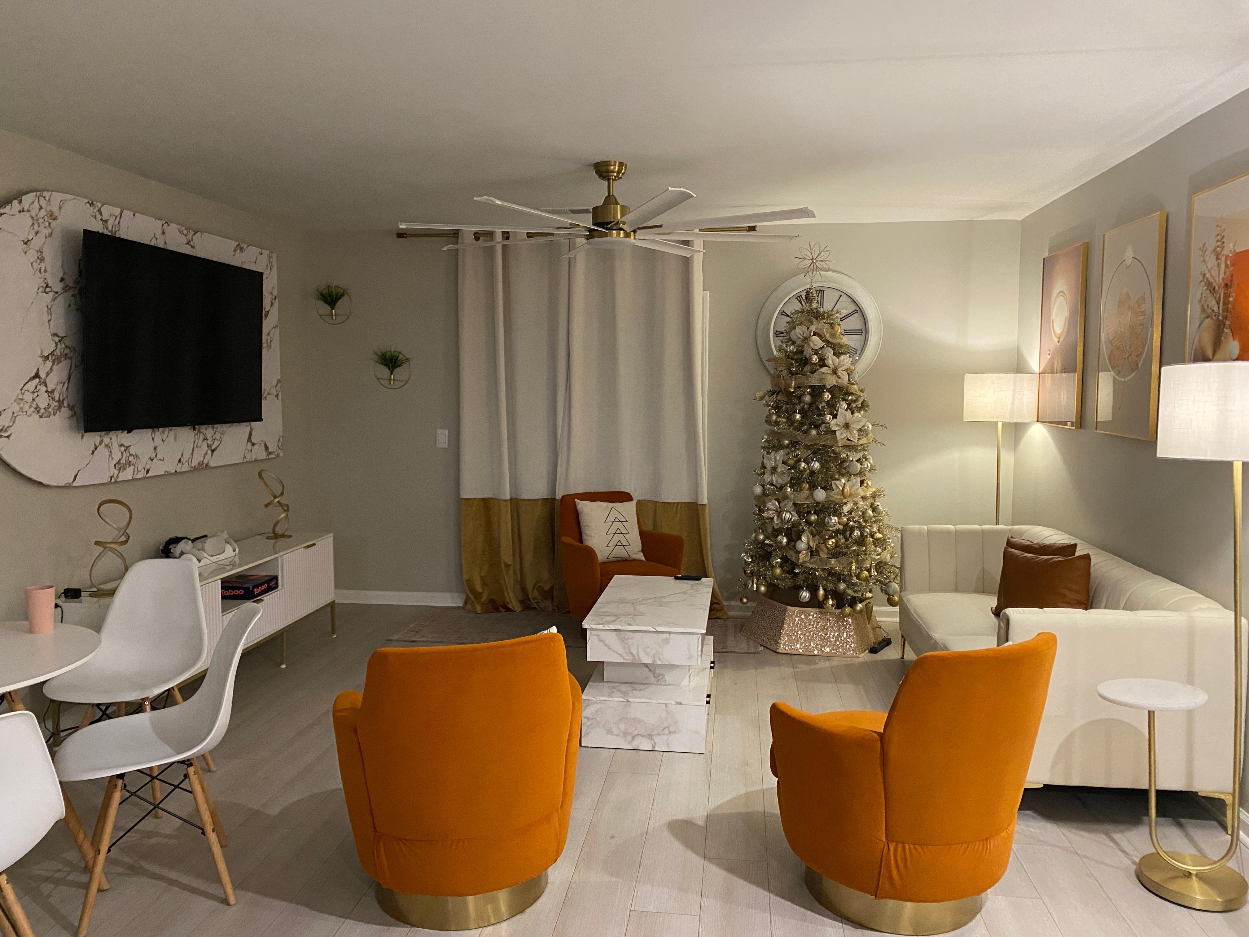 The living room complete with festive Christmas tree to celebrate the season!