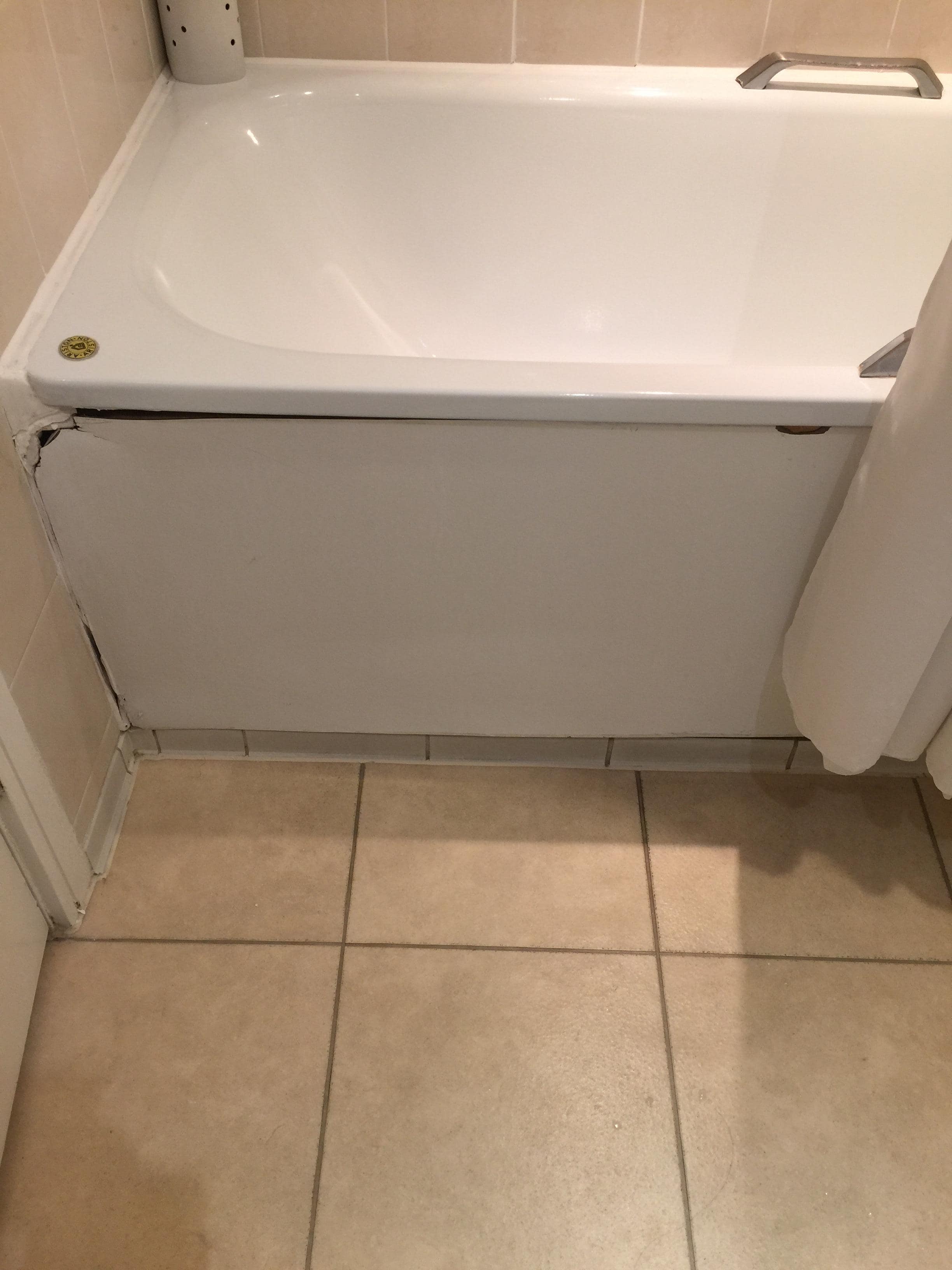 broken bathtub wall