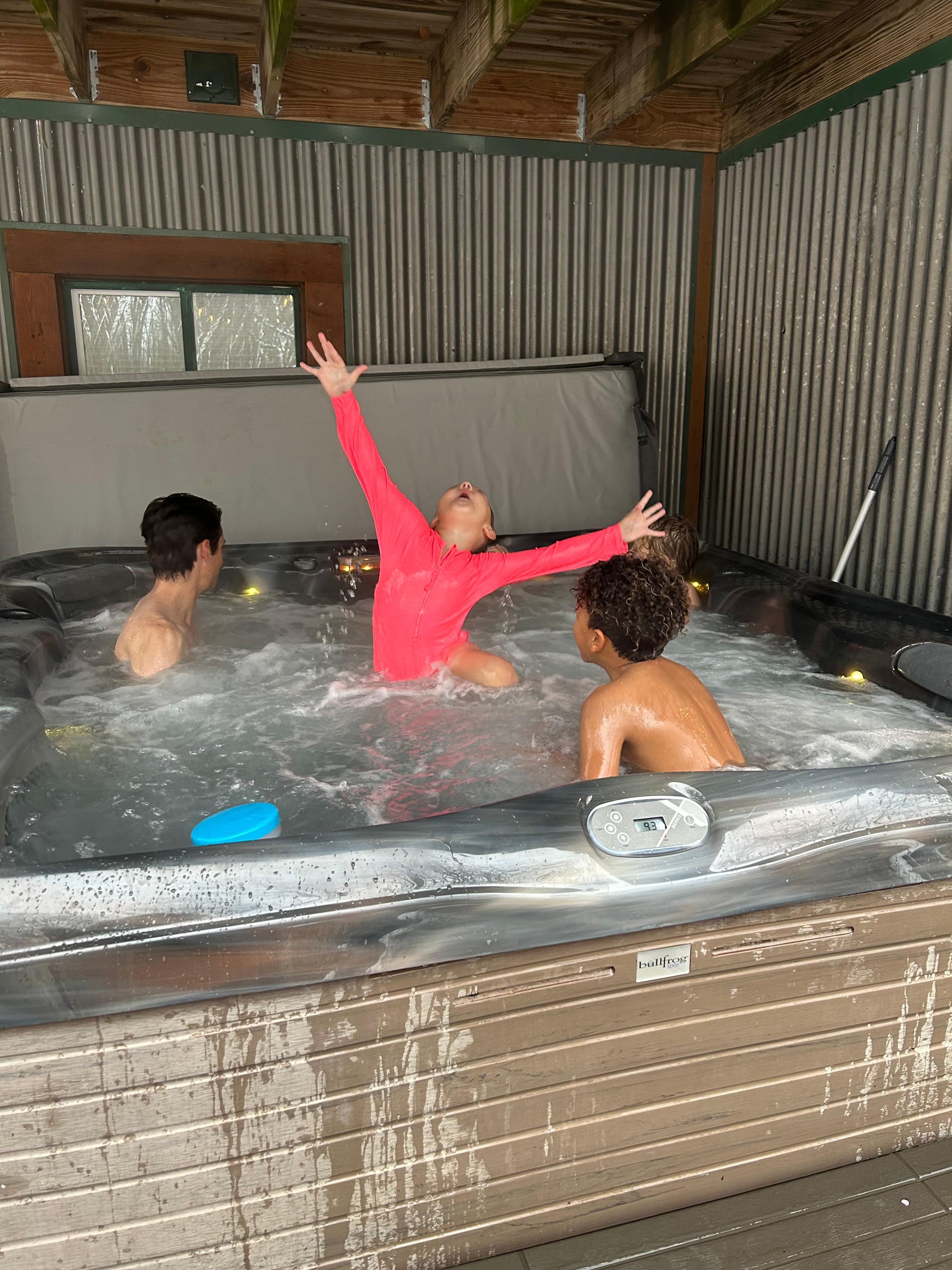Kids enjoying the spacious hot tub 