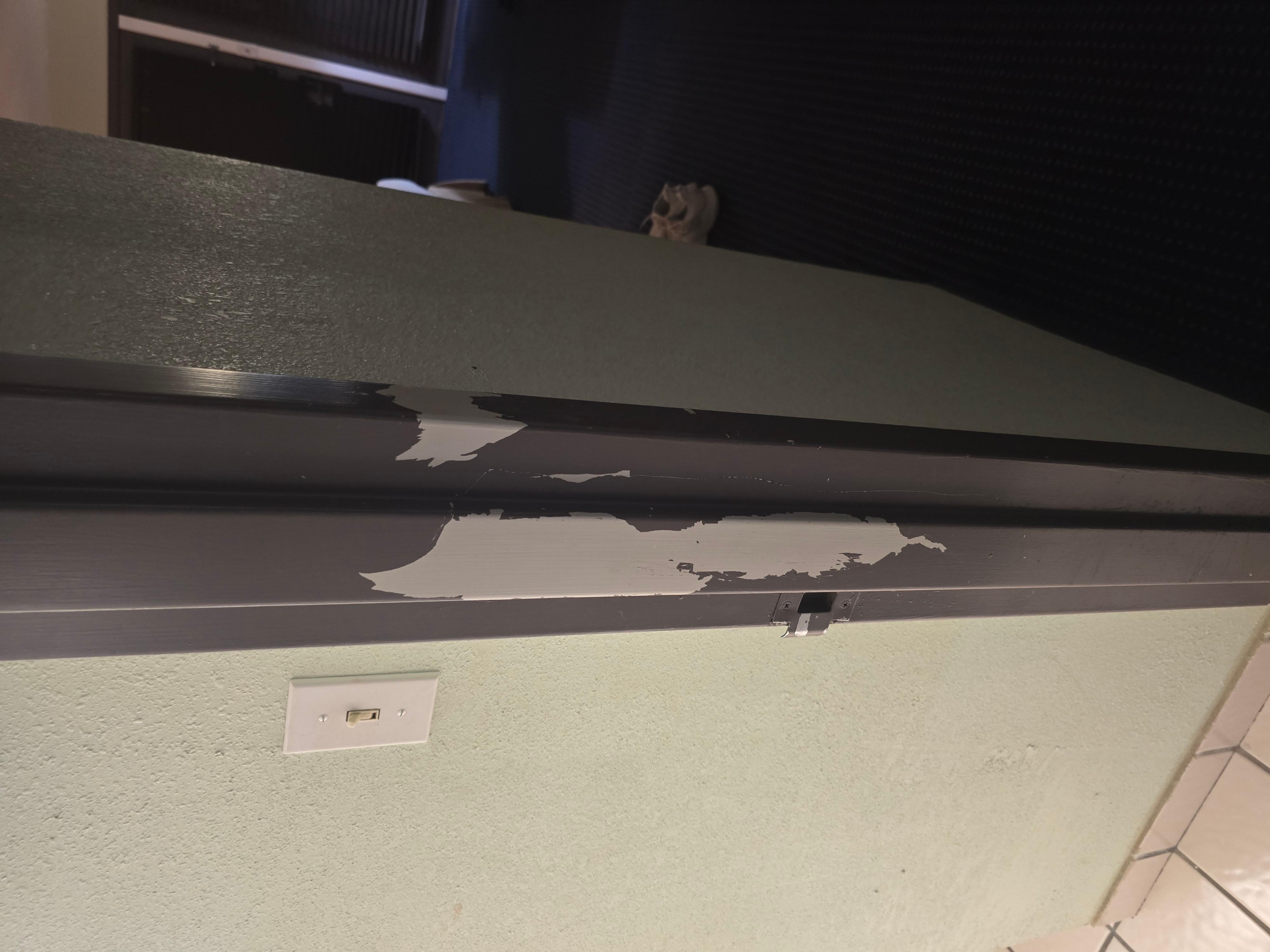 Missing paint in bathroom door jamb