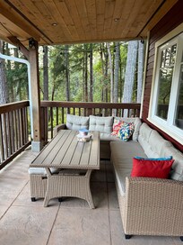 Porch with comfy sofa and a great view
