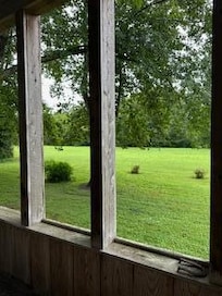 A picture from the deck looking towards where the small picnic area sits near the creek.