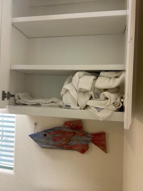 towels thrown in cabinets 