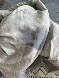Sticky, wet mark on the comforter