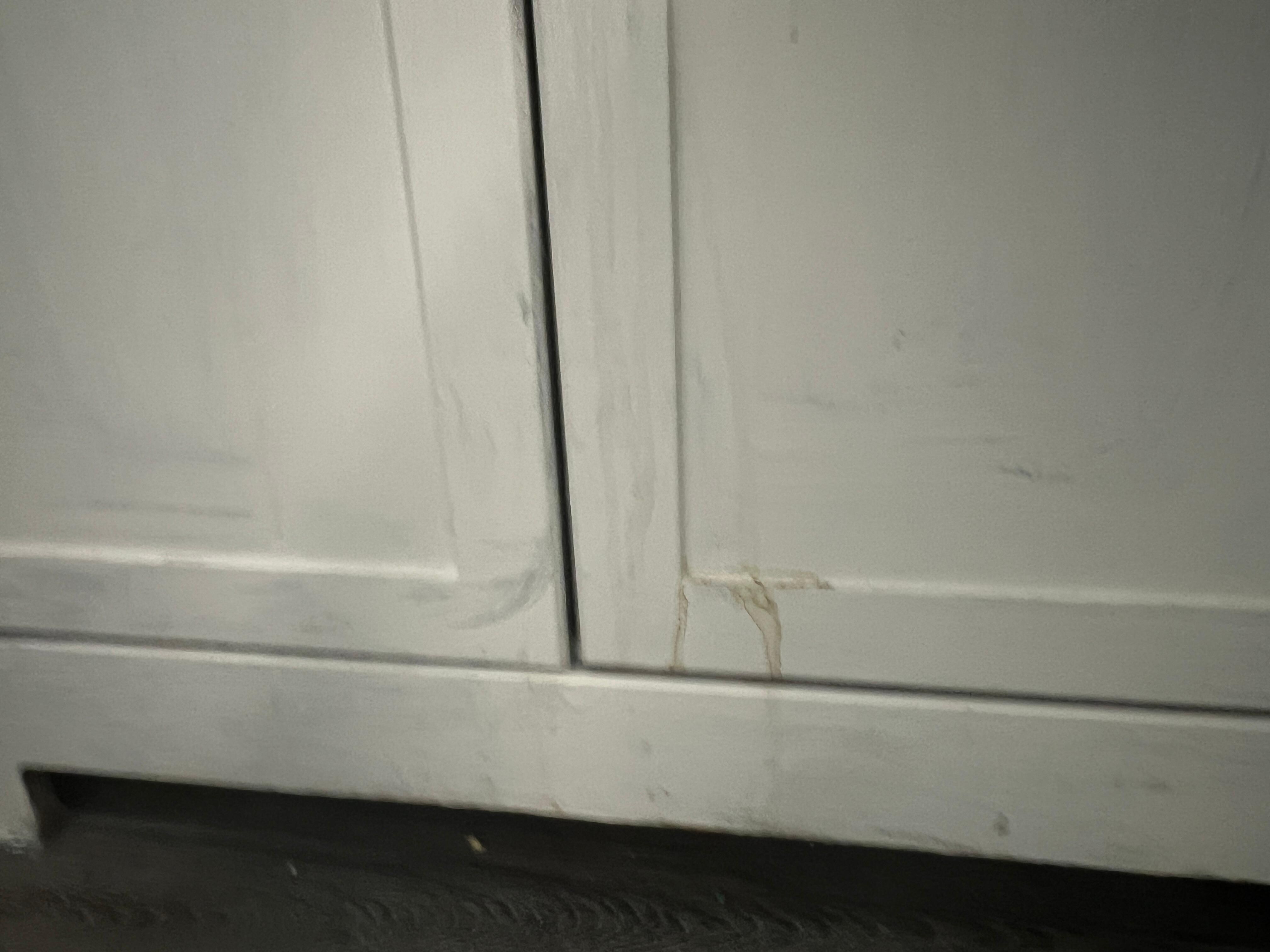Unknown substance on cabinet 