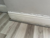 One example of walls that need paint and crack repairs