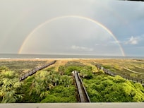 Rainbow after a storm from the deck. Zoomed OUT to capture the entire rainbow.