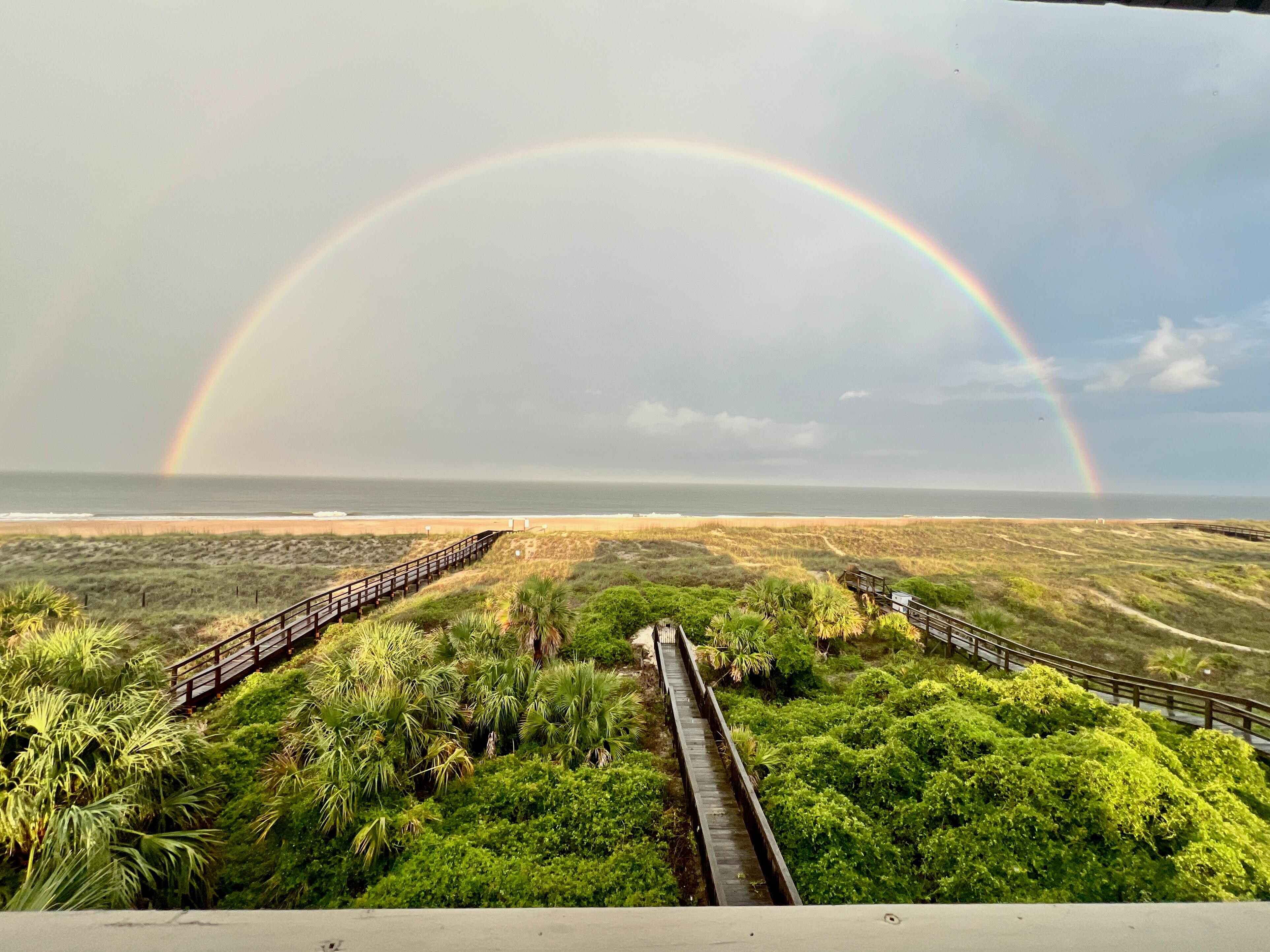 Rainbow after a storm from the deck. Zoomed OUT to capture the entire rainbow. 