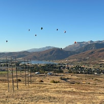 Balloons rising across the valley as seen from the deck!