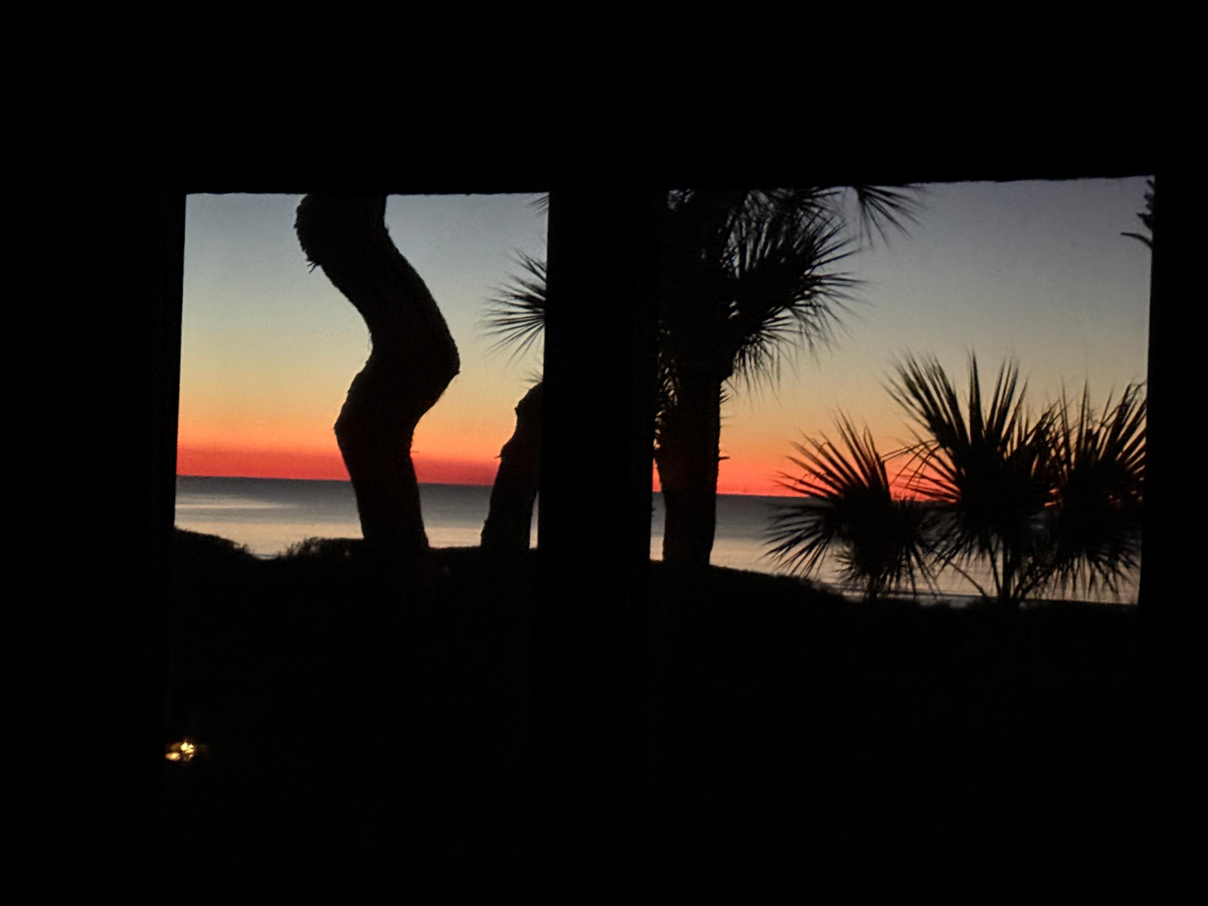 Sunrise view while laying in the bed. 