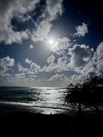 Full moon over the ocean from the front of condo