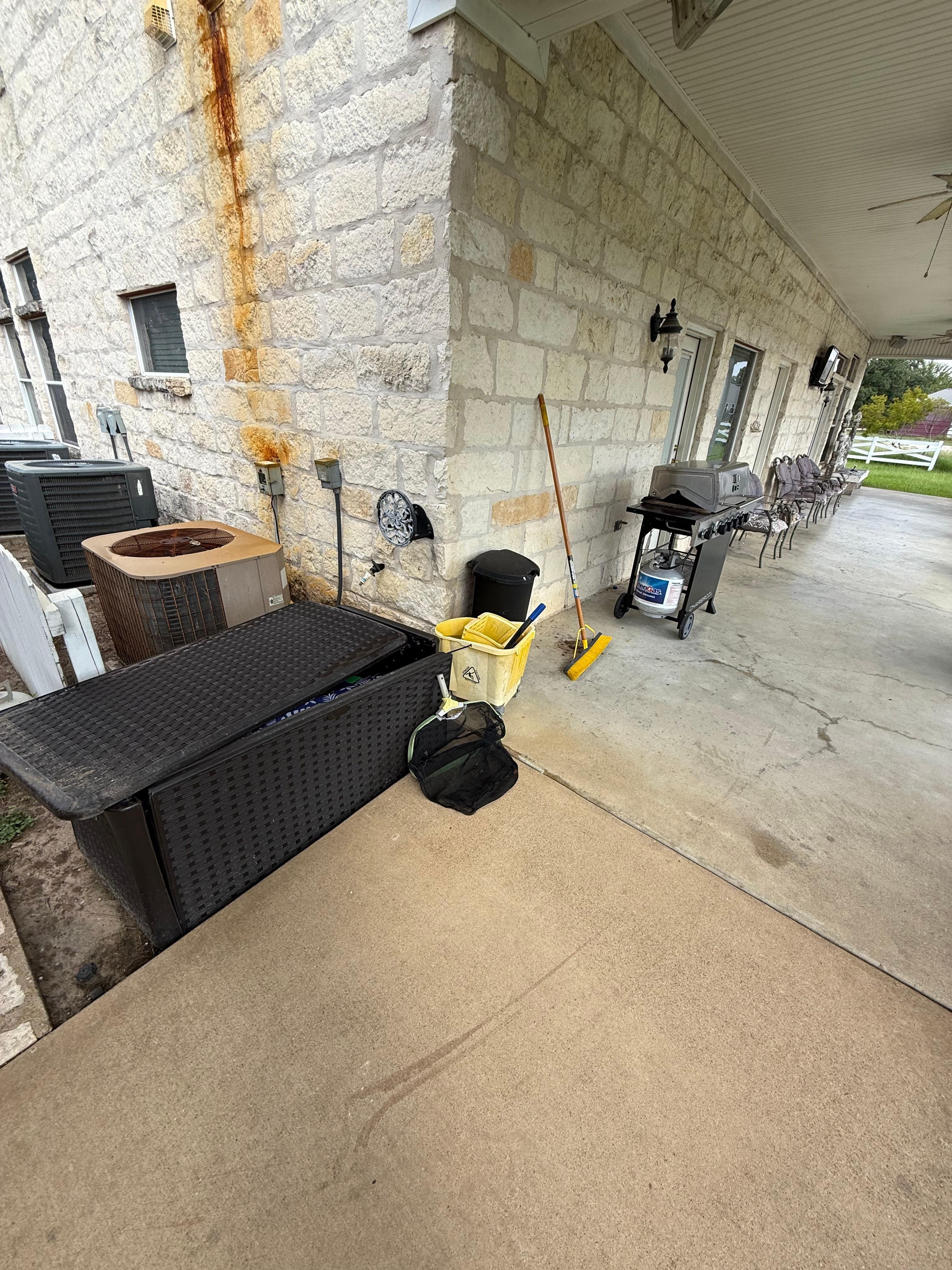 Dirt mop bucket on the back patio 