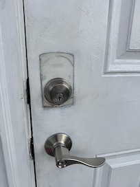 First impression of the home was a dirty and unpainted front door