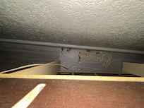 Popcorn kernels under the nightstand