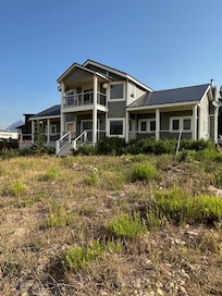 The front view of the house as you drive through the entrance gate.