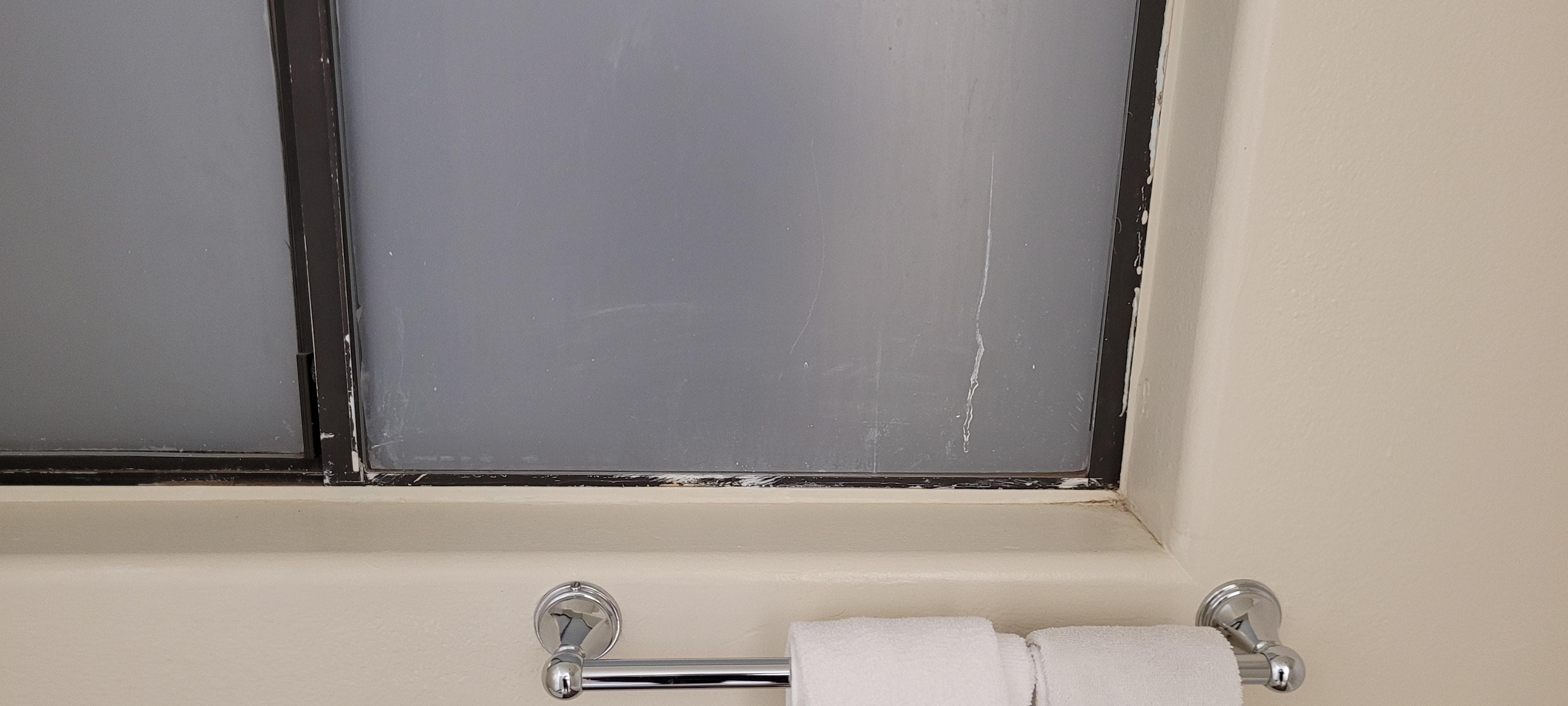 Paint on window glass and privacy film tampered with