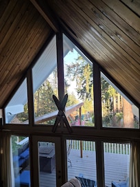Up the stairs by the upper loft bedroom, and viewing all the beautiful windows.
