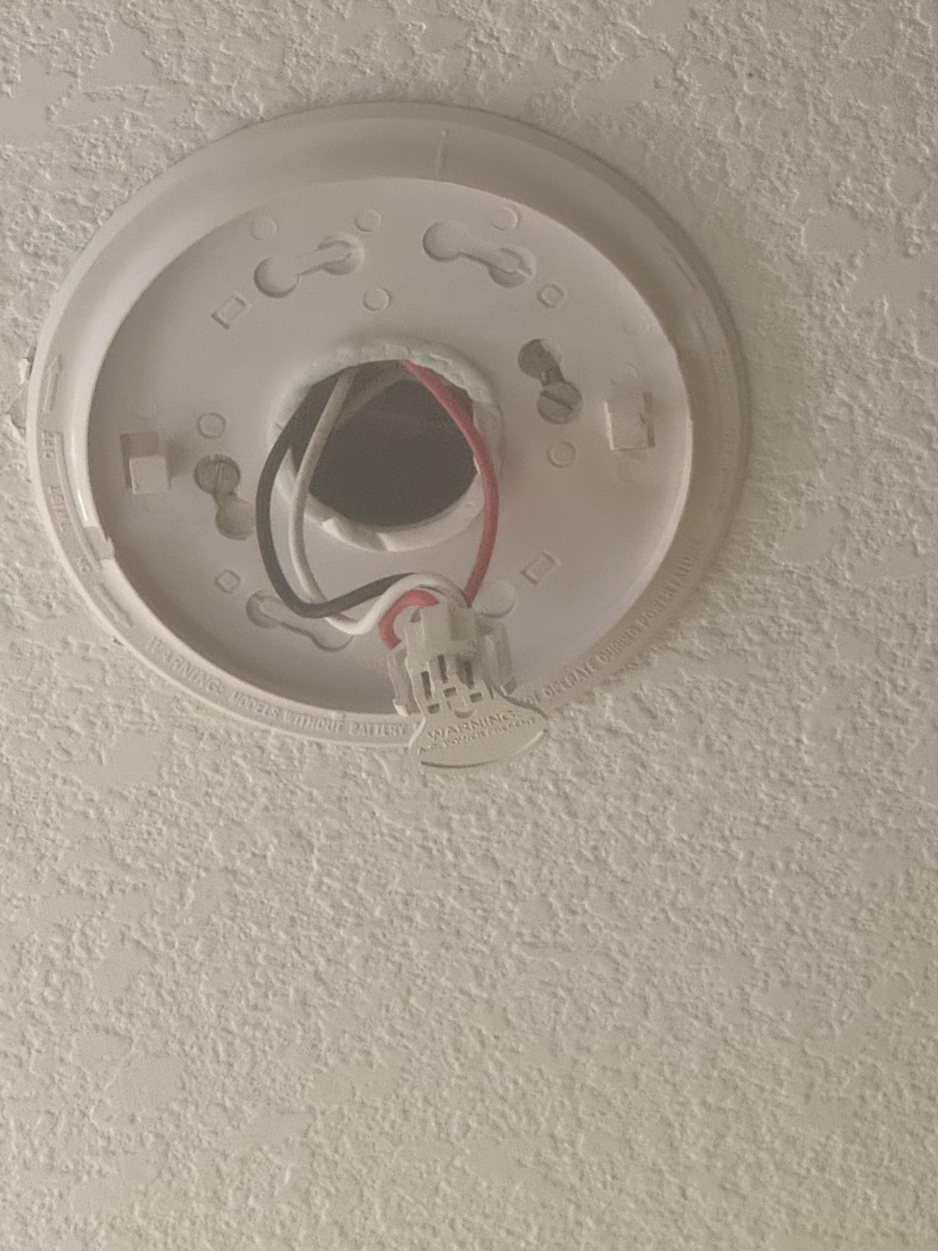 No smoke detector hooked up in room.