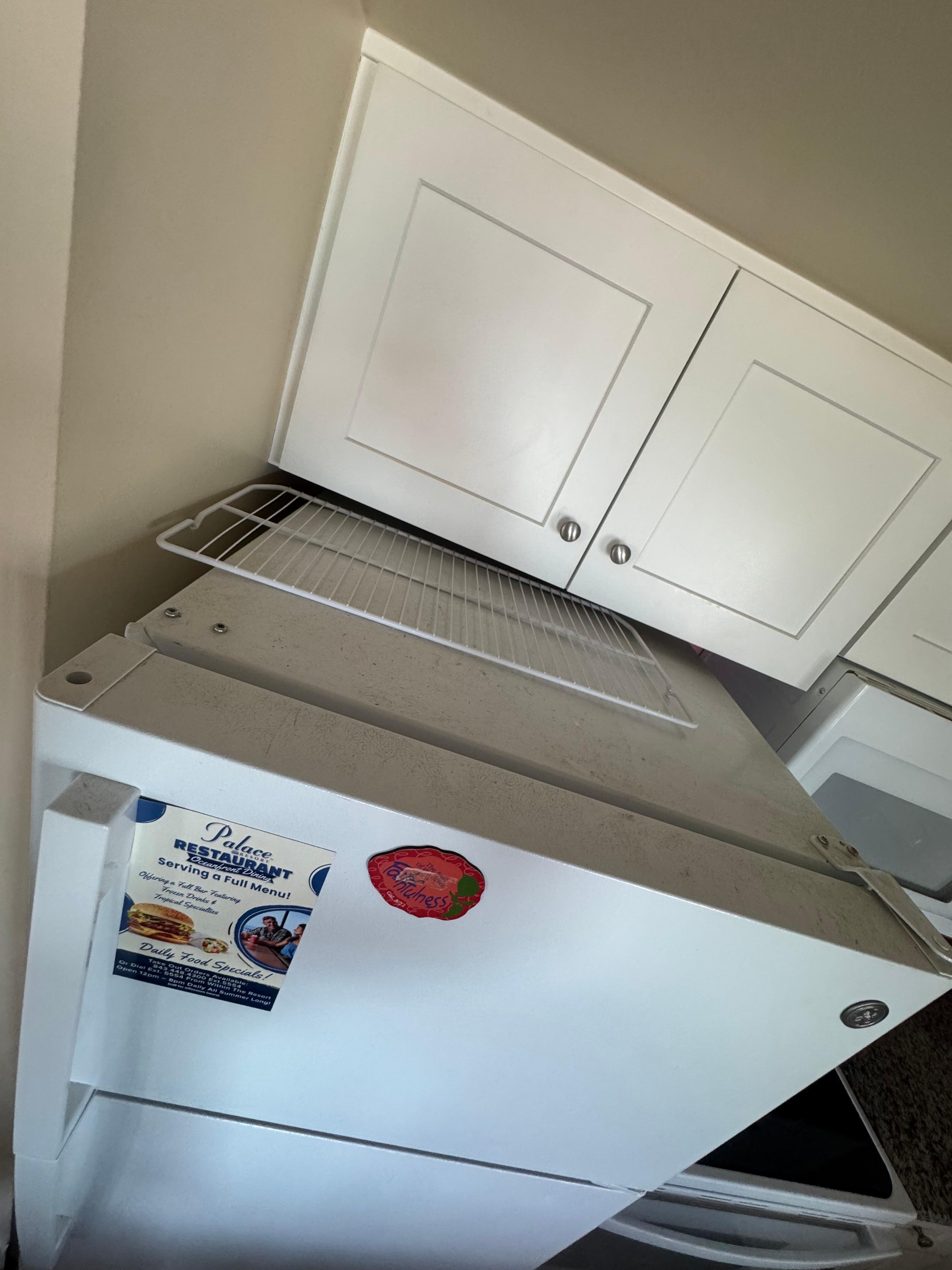 Top of fridge caked in dirt