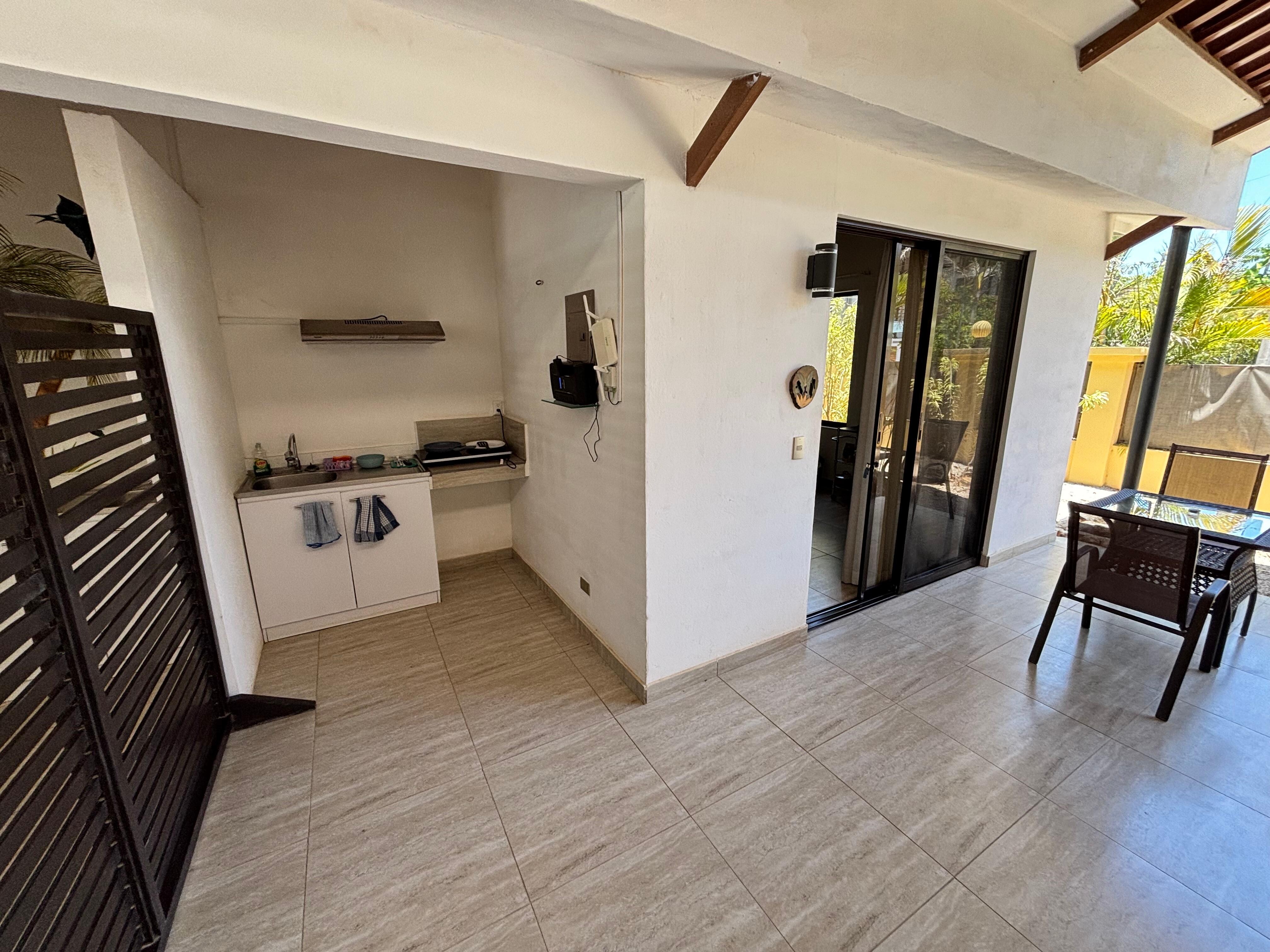 The sink and cooking area is located outside; while all the utensils, dishes and cookware are inside 🤷🏻‍♂️