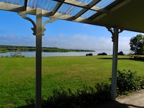 A full verandah circles this house - on a calm and calm day, this is the view from several really comfy outdoor seats!