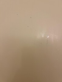 Purple soap on shower wall upon arrival