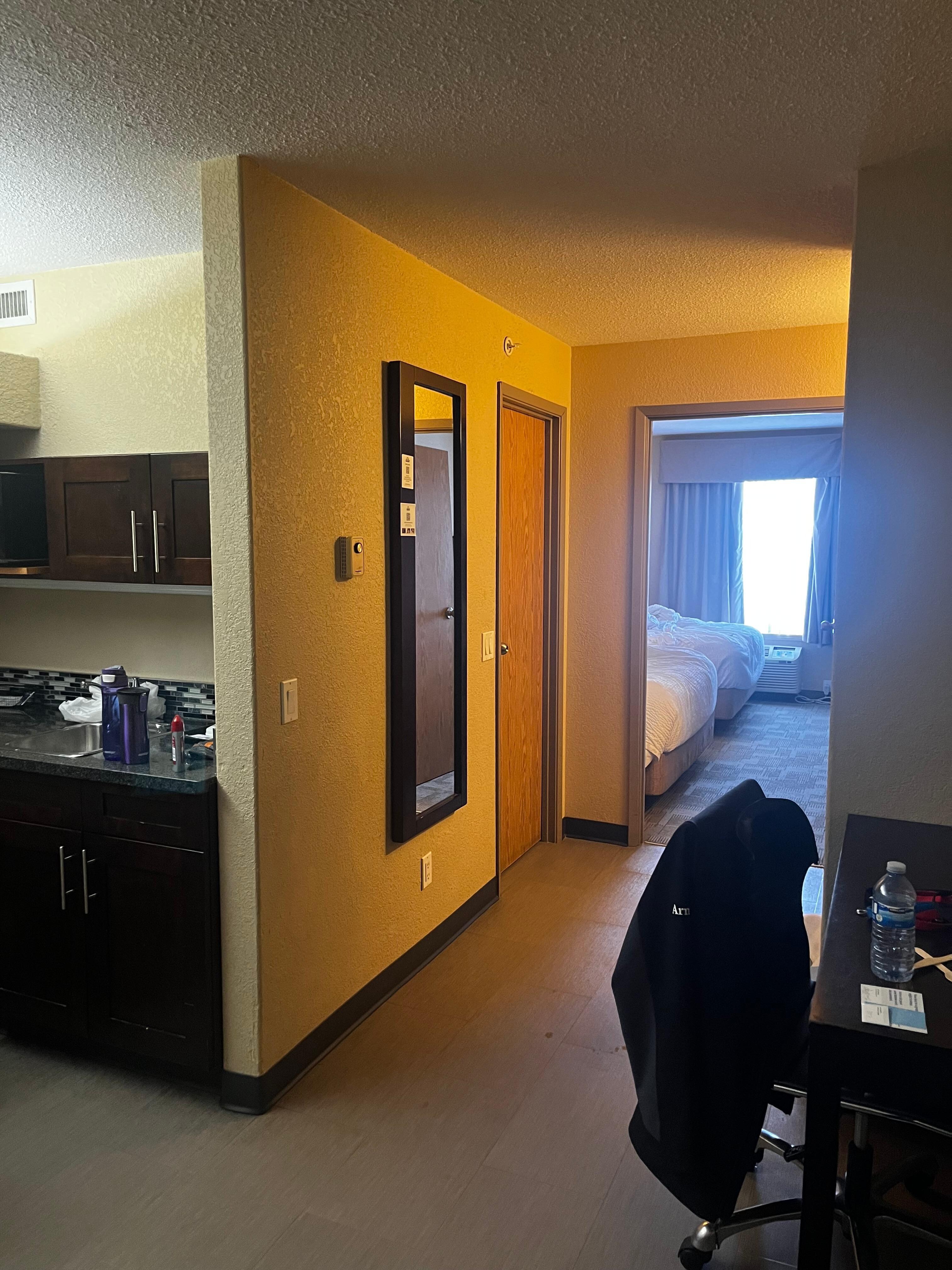 Looking from main door. Toilet and shower in the door on the left, sink was across from the door. Standard two queen beds in far room. 