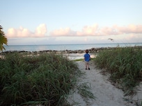 Precious grandson surveying the beautiful ocean view from the villa.