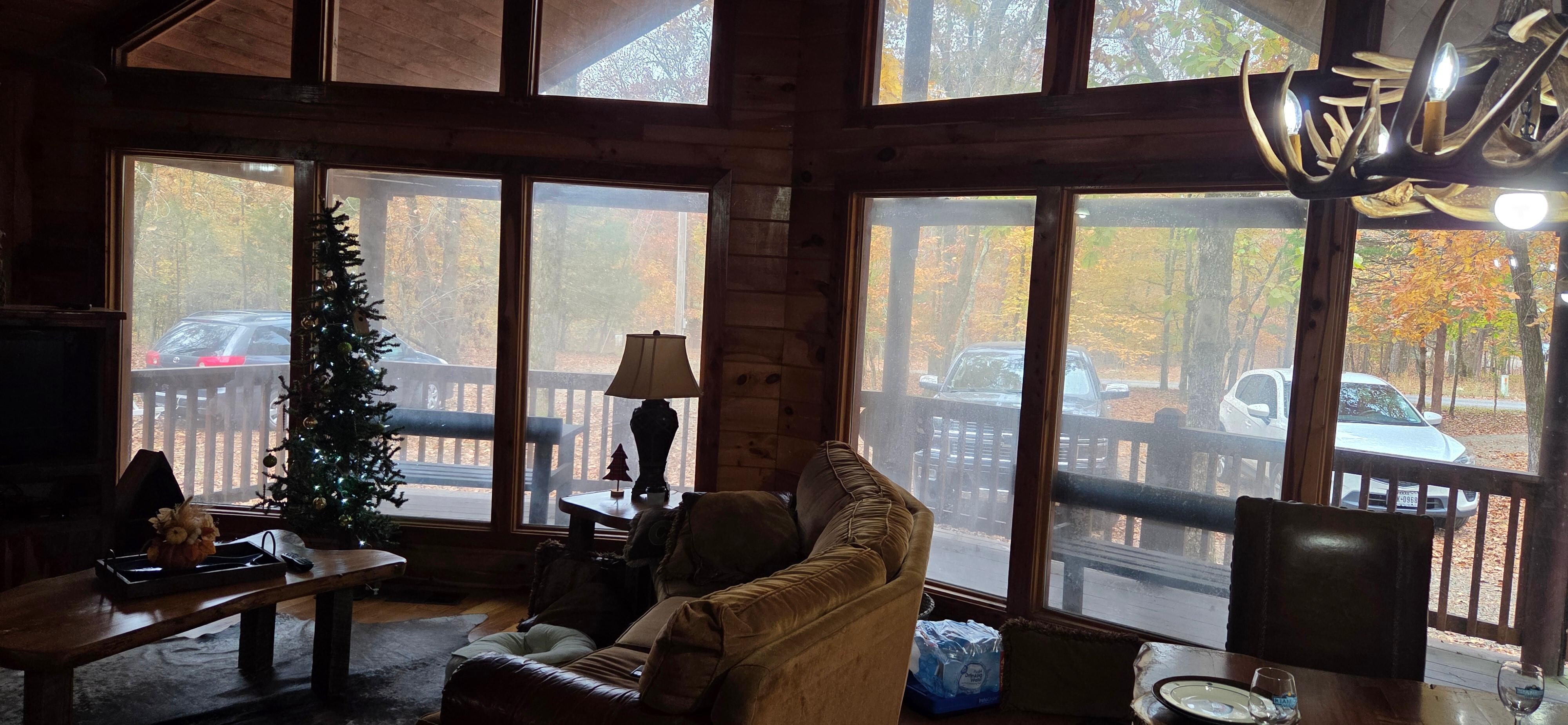 Living room windows, all but one fogged over.