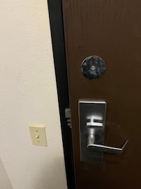 Room door blocked and left open by staff all day.
