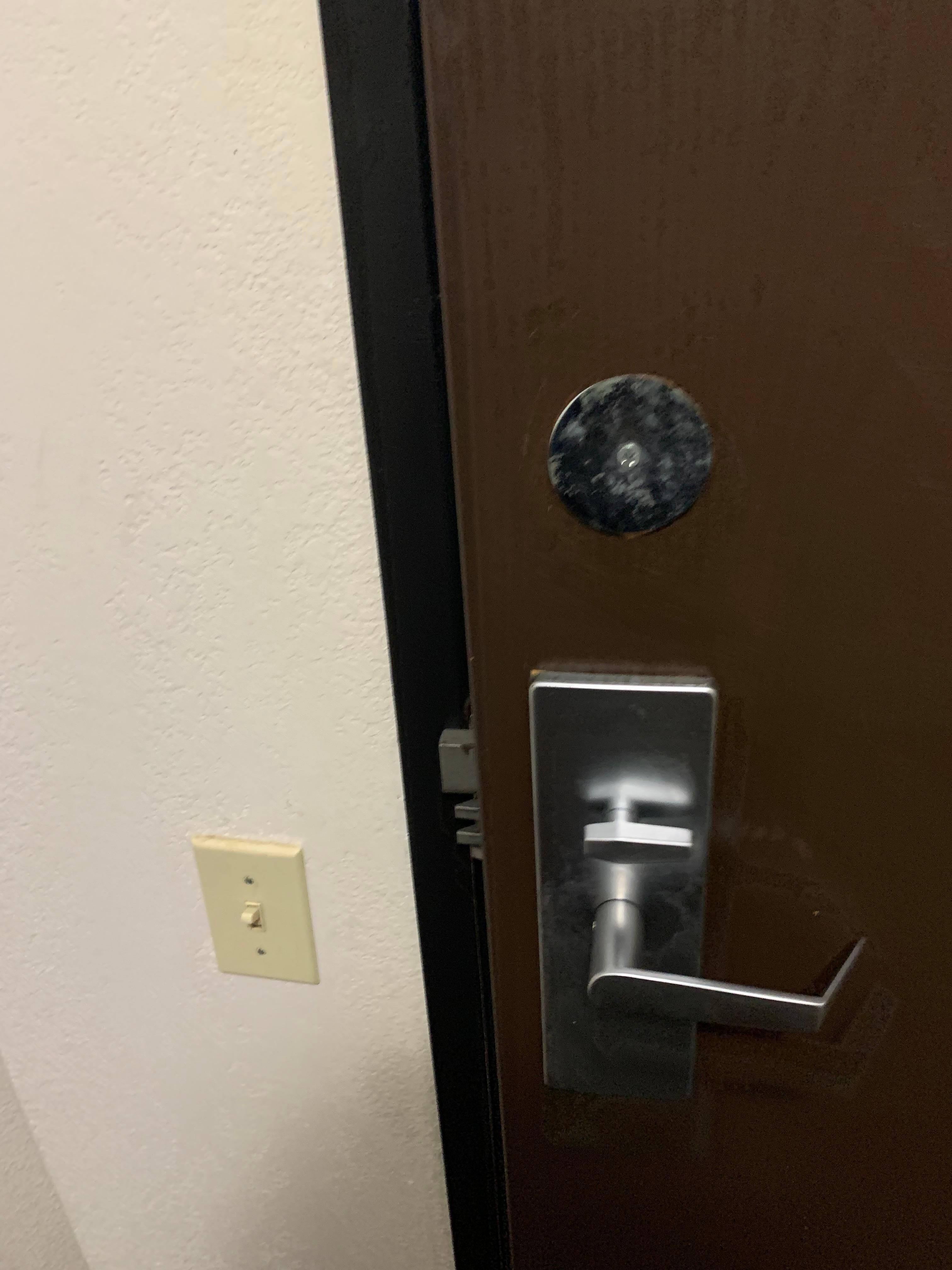 Room door blocked and left open by staff all day.