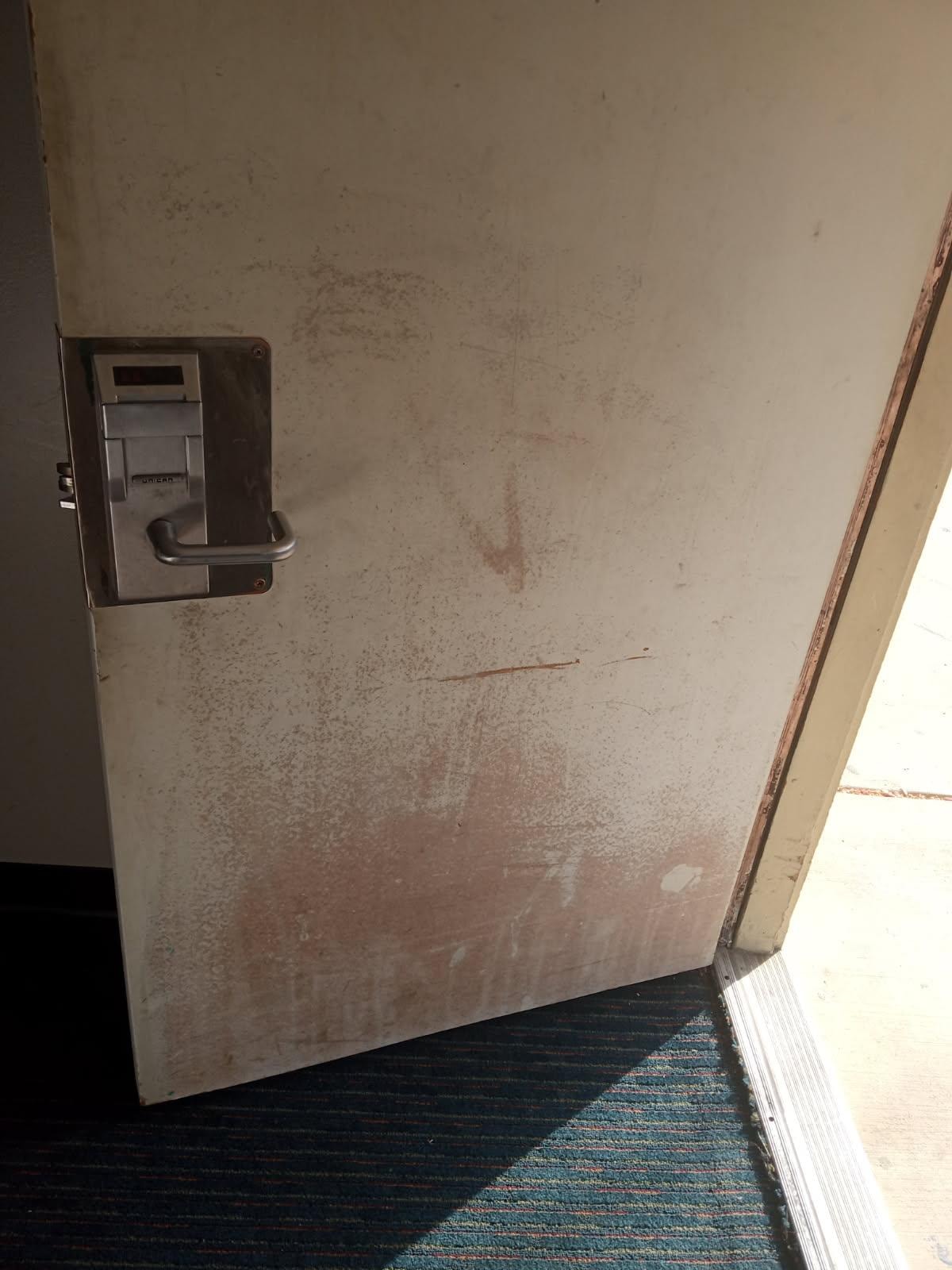 filthy walls and door