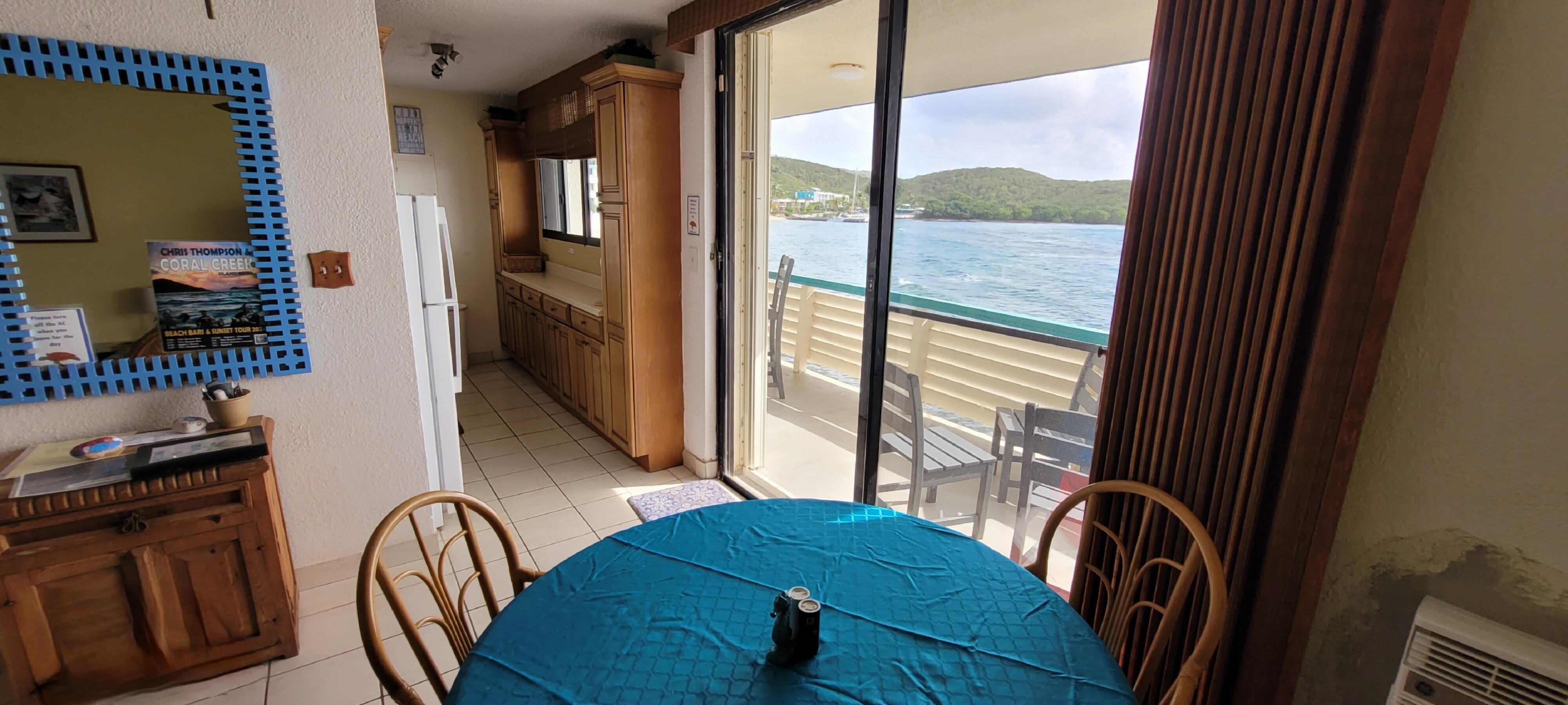 Views of the ocean from dining room & into the kitchen