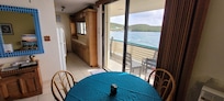 Views of the ocean from dining room & into the kitchen
