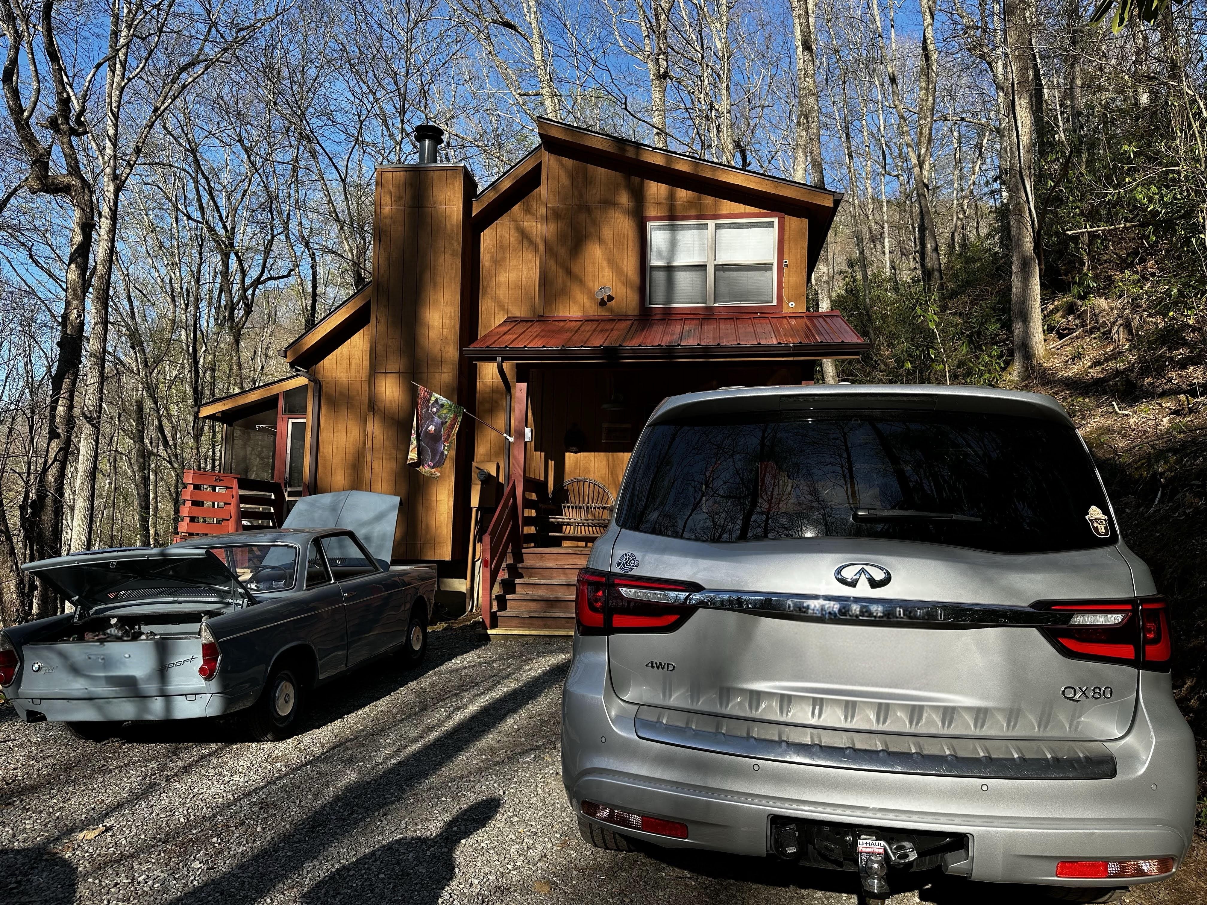 Driveway is gravel and narrower than it appears in photos