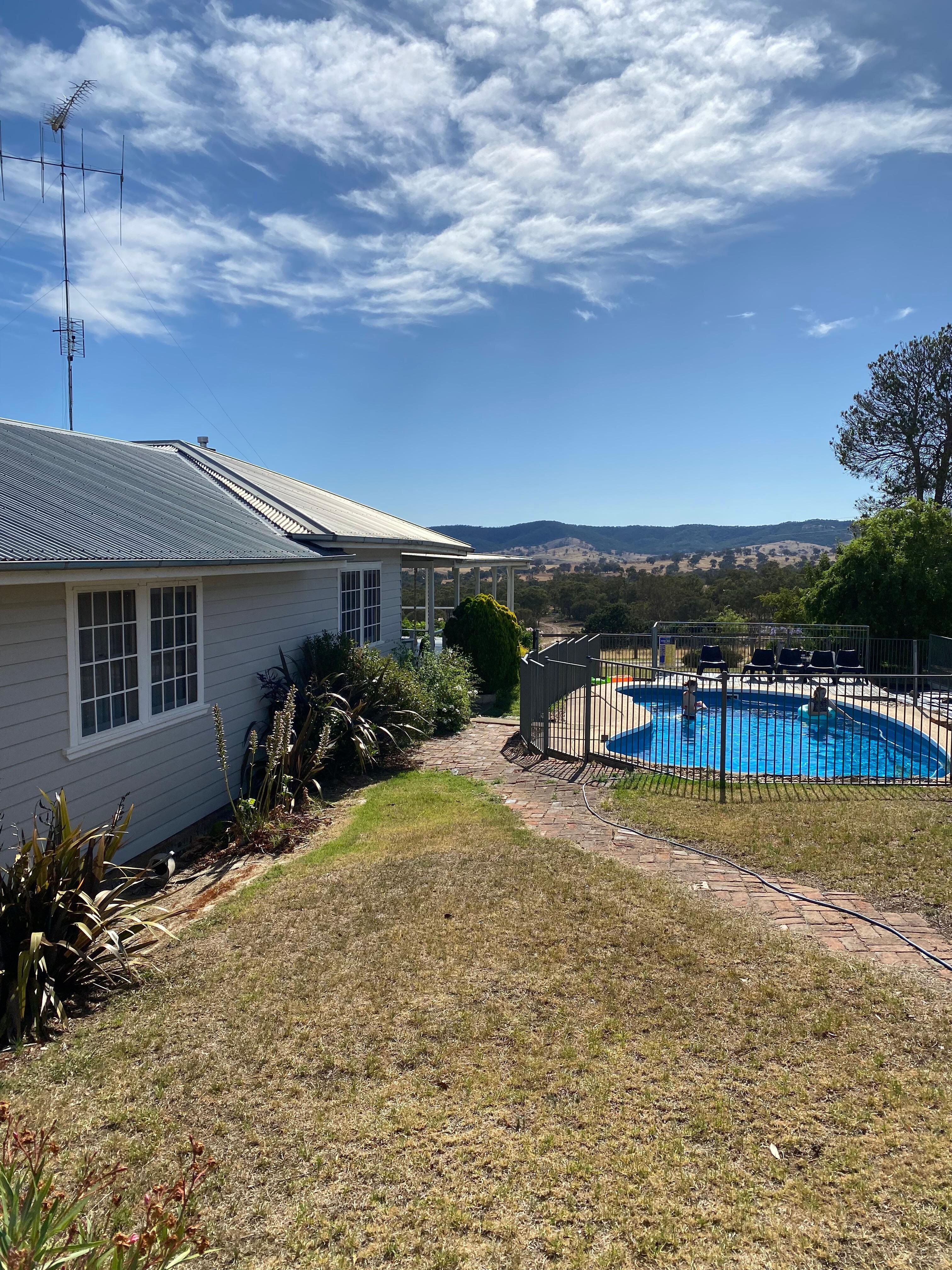 Fully fenced Pool next to house 