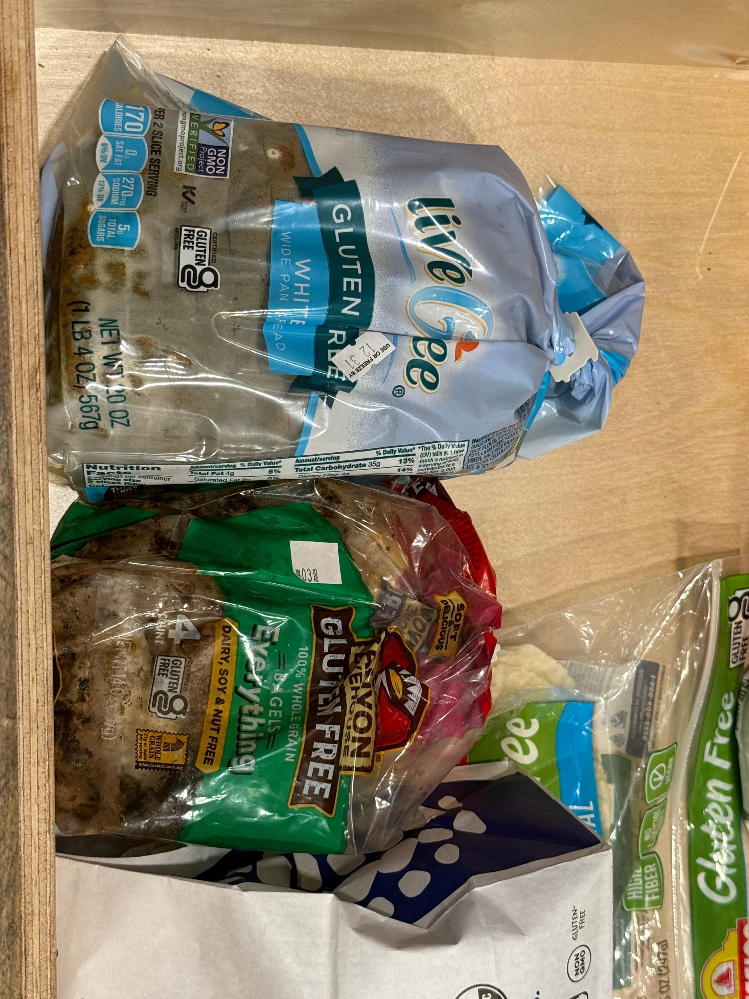 Moldy food in drawer.  Dirty vase in sink & flowers in trash.