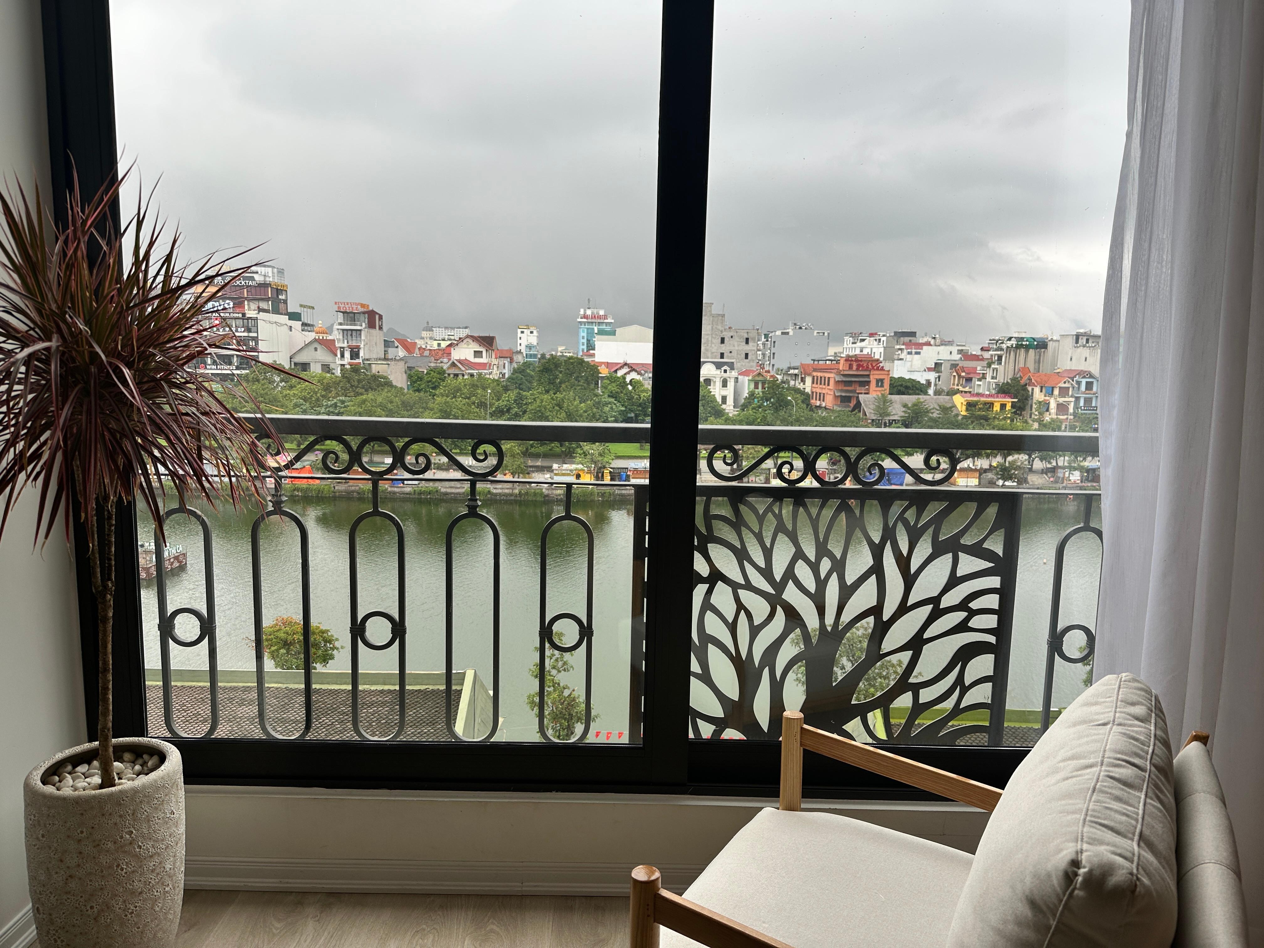 Very large window view of the water. 