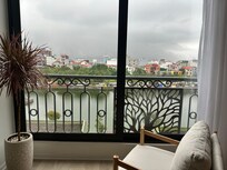 Very large window view of the water.