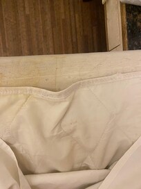 Bed without fitted sheet.