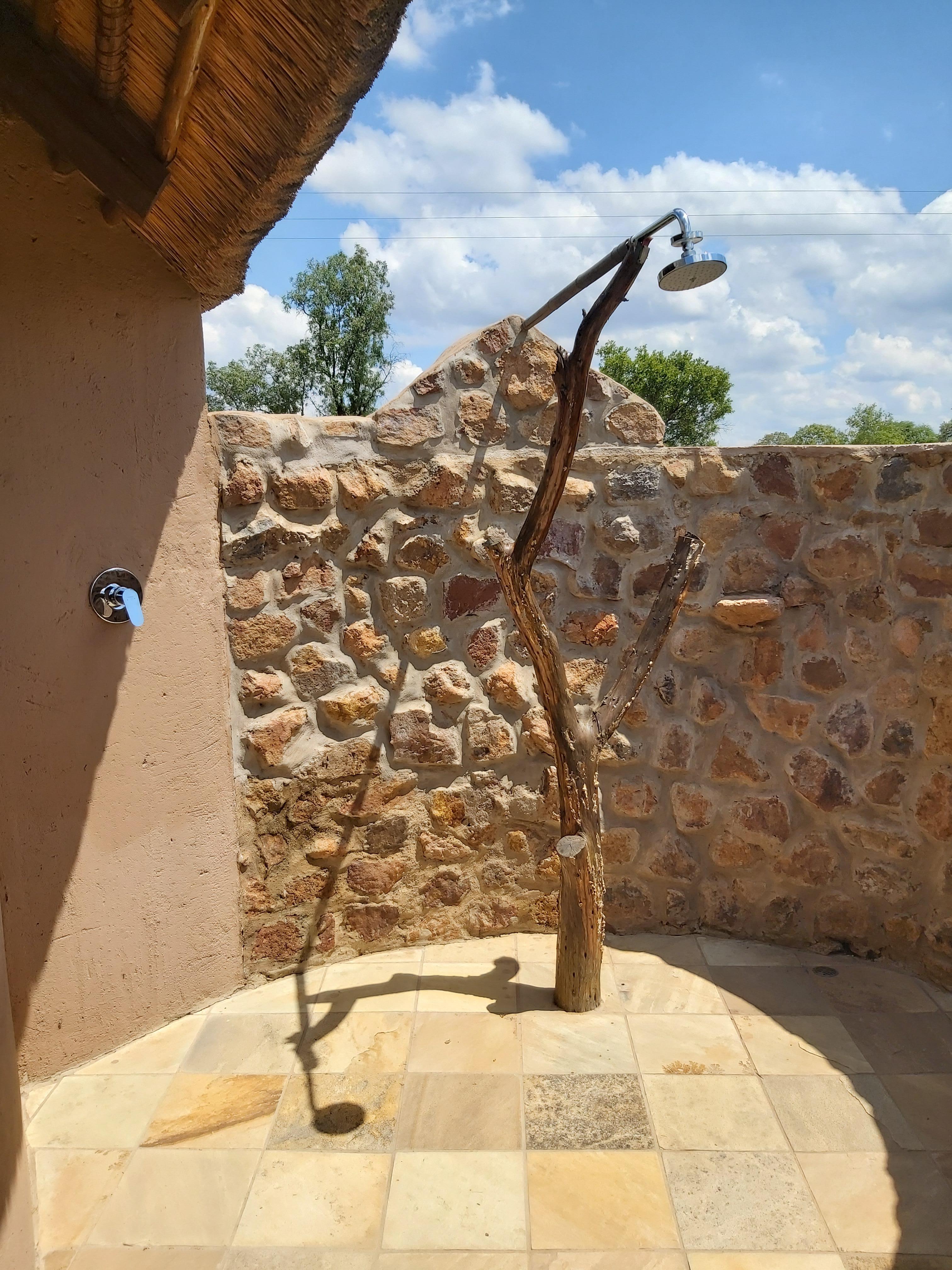 Outside, private shower with views of the bush