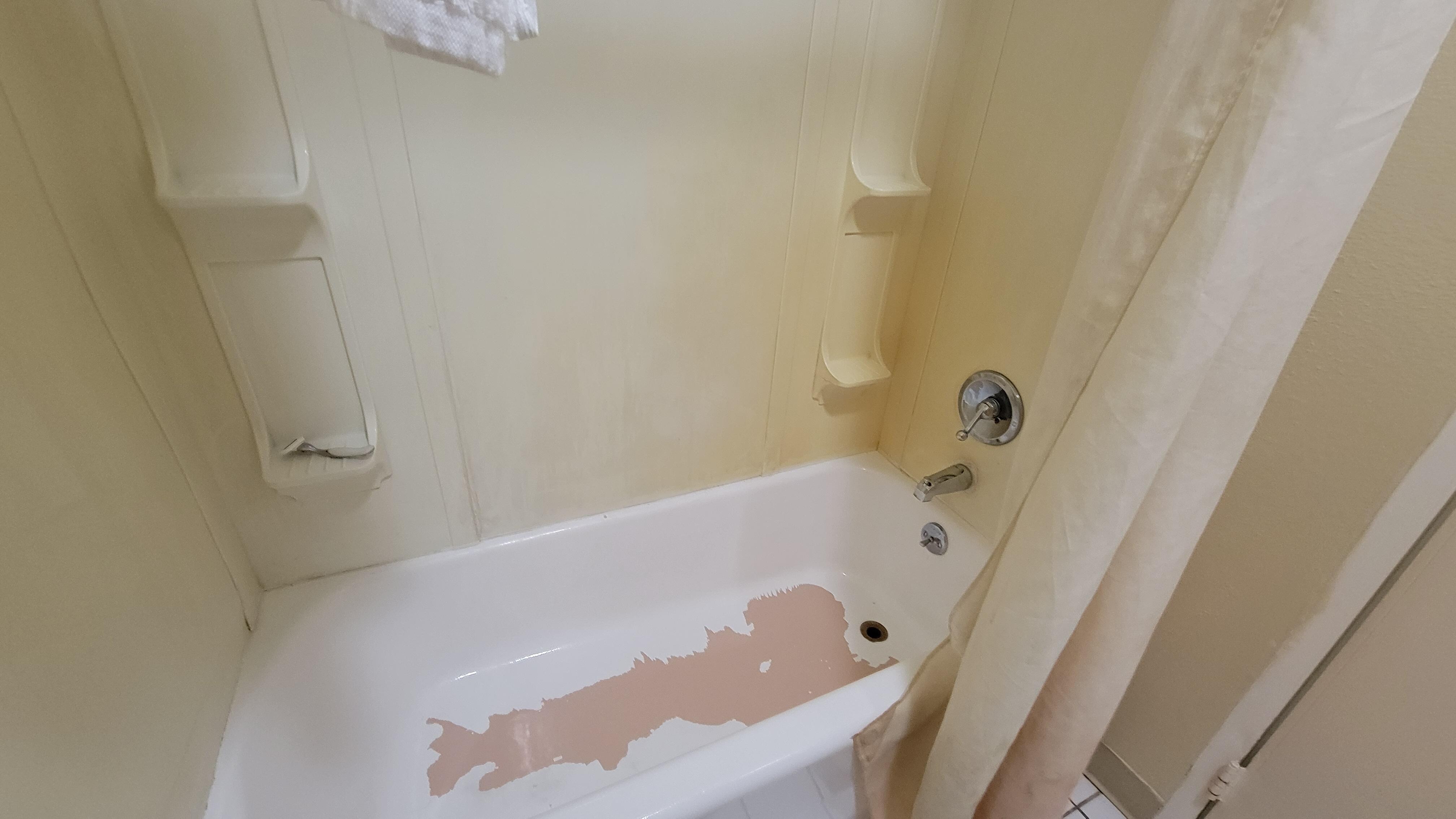 Tub with peeling paint.