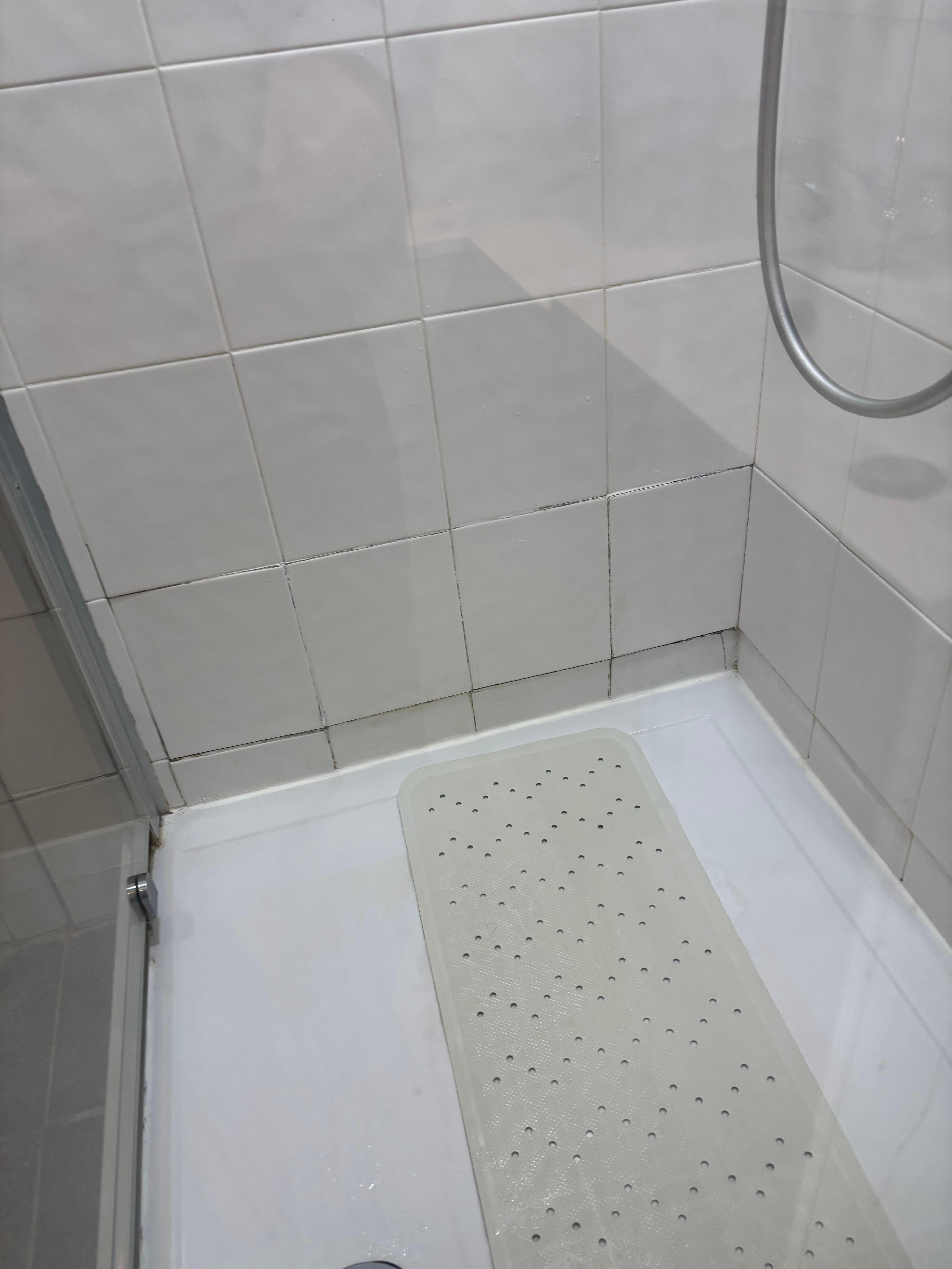 Uneven tiles in shower poorly fixed 