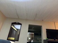 Ceiling stains and sagging paint.