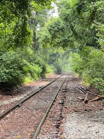 Down street of train tracks