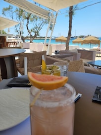 The restaurant and bar area is on the beach.