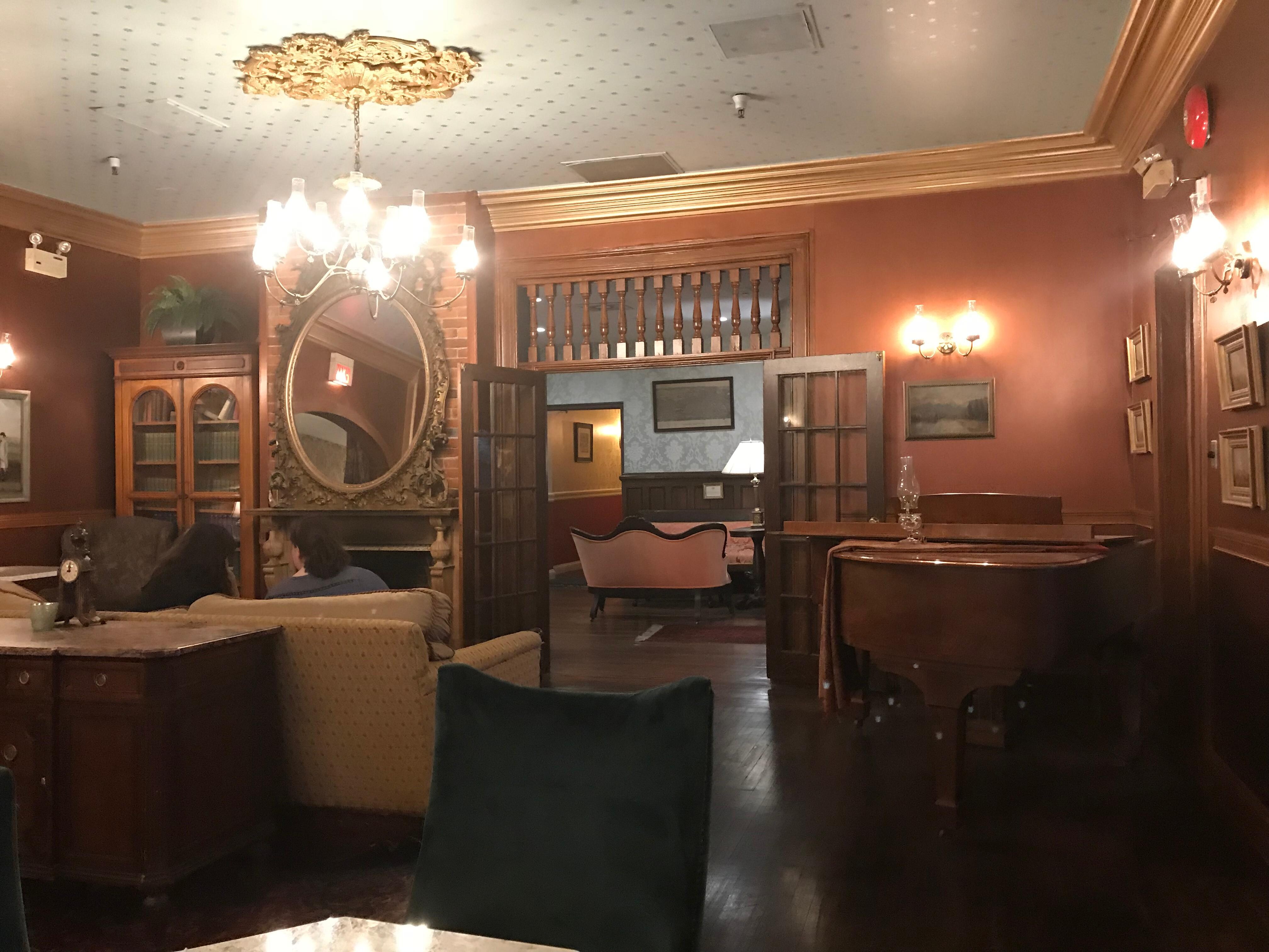 The living room, complete with player piano, fire, and clock