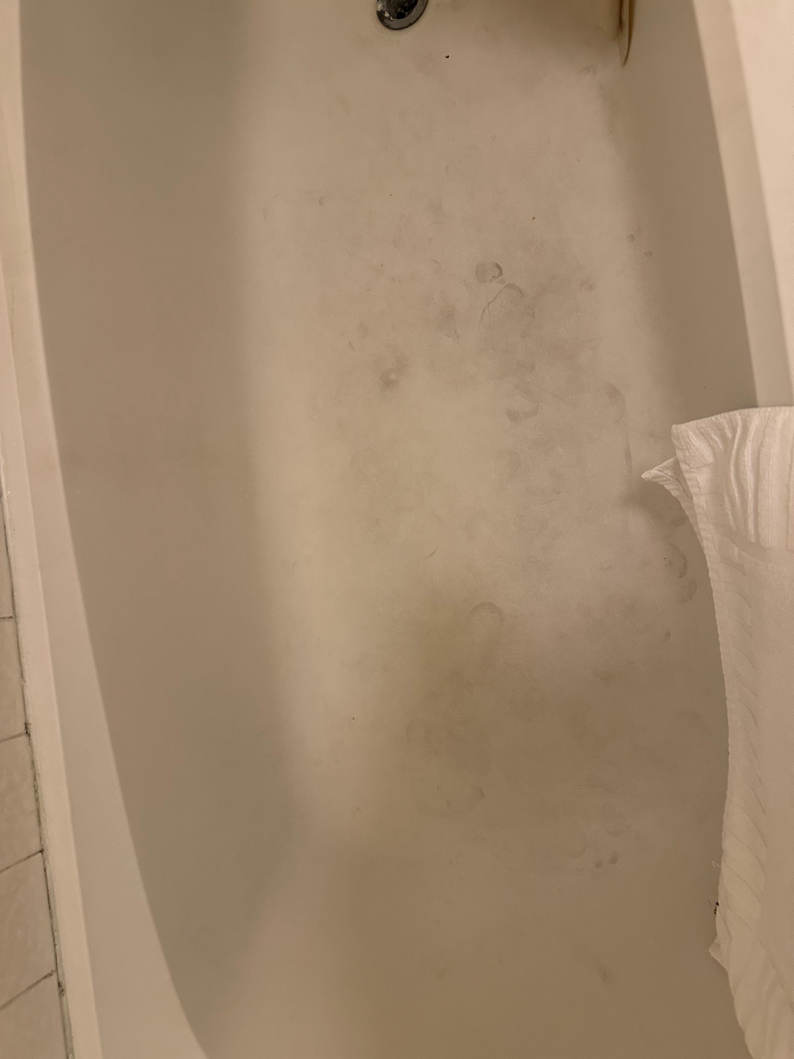 Dirty stained bathtub