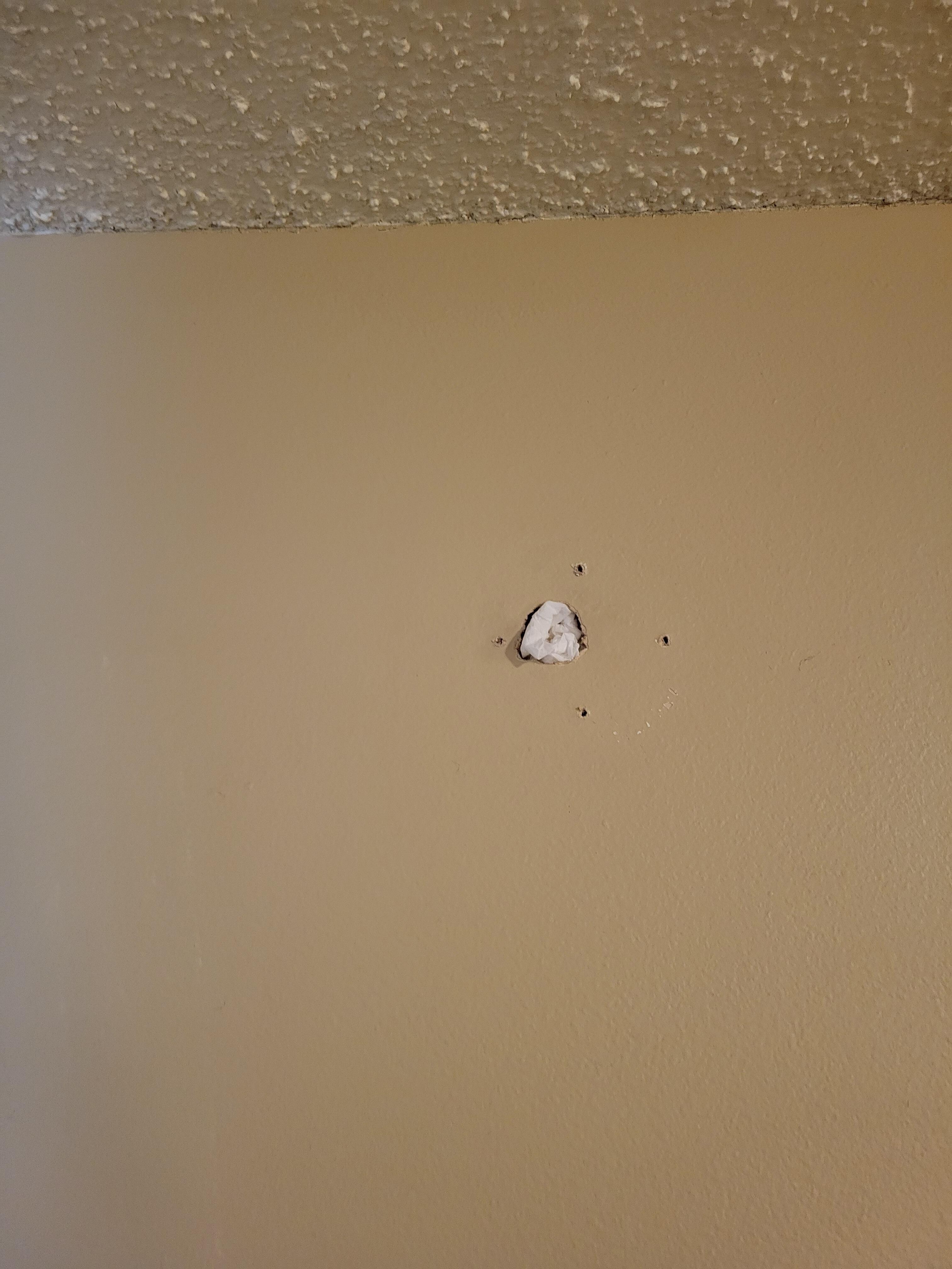 hole in the wall with tissue